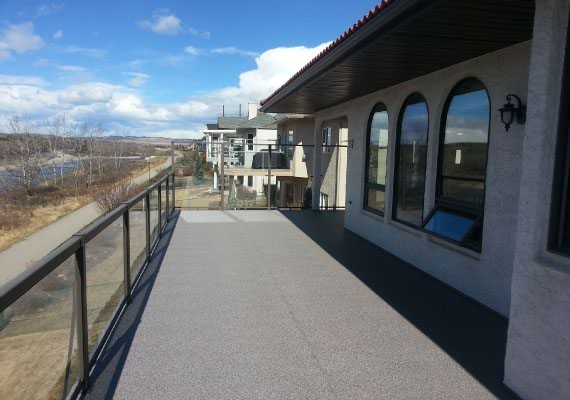 Metal and glass railings with a wind break and our vinyl decking.