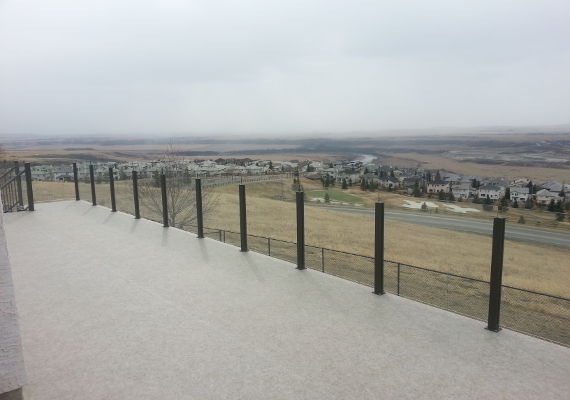Infinity glass railing with our vinyl decking.