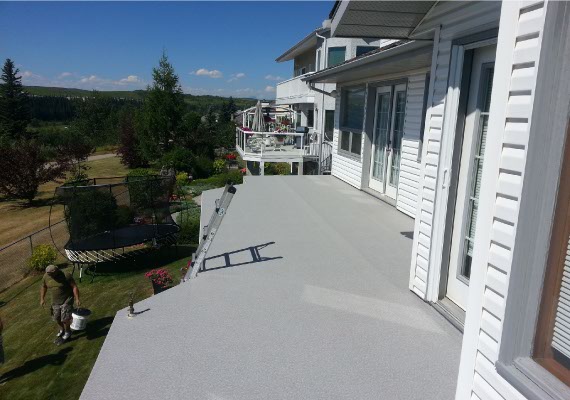 Vinyl decking has been installed, railing in progress.