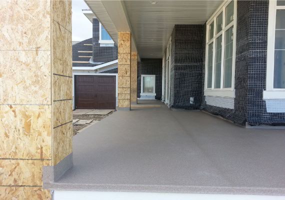 Vinyl decking post installation on a new construction home.