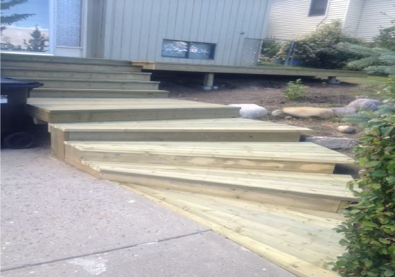 Wooden deck with flared corner.